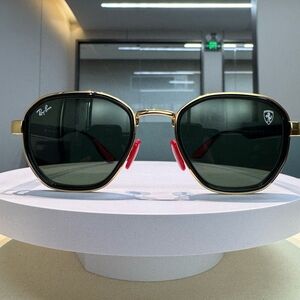 Ray-Ban Gold Frame Sunglasses with Black Lenses and Red Details